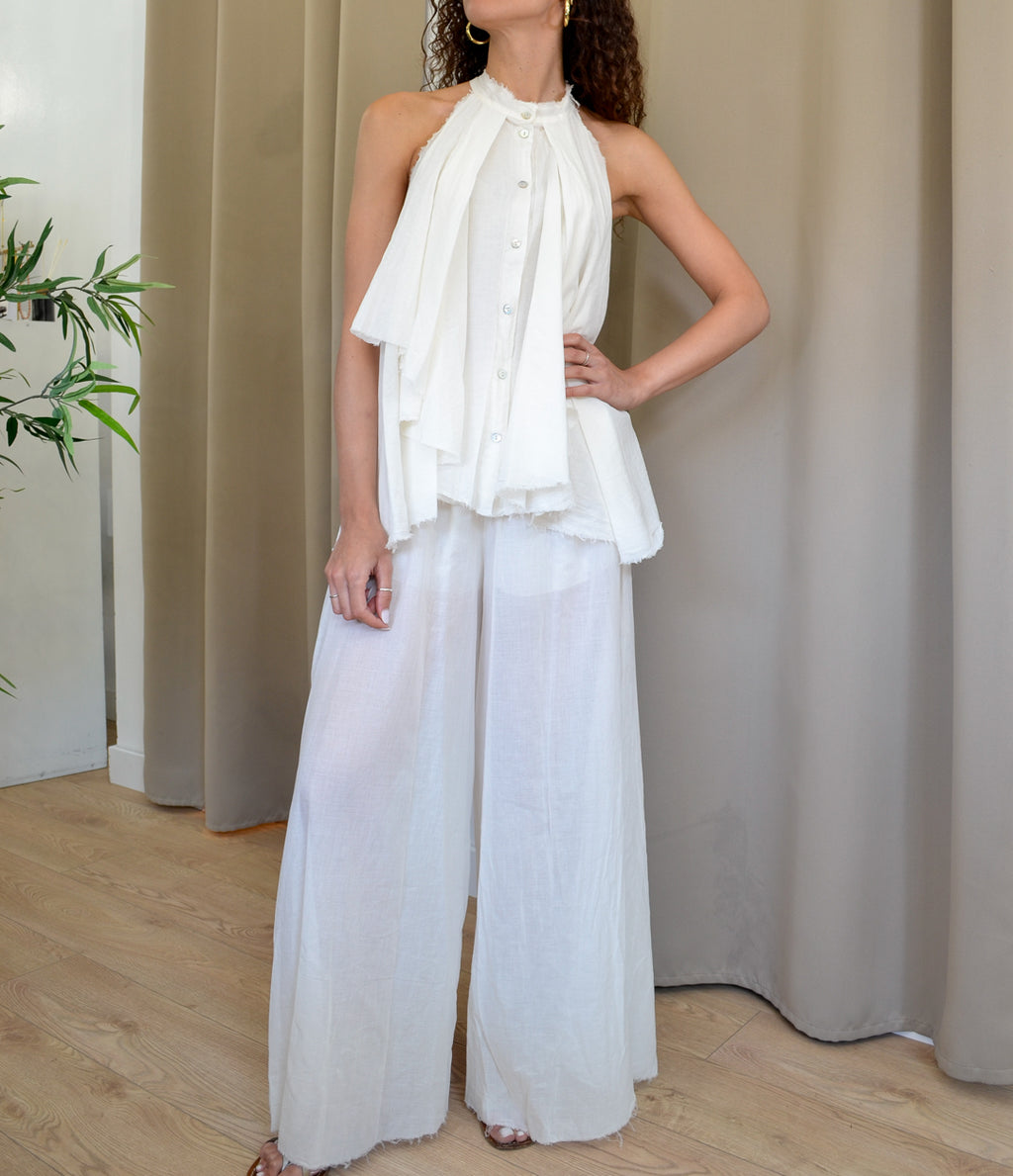 Pantalone palazzo bianco e top coordinato in mussola di cotone con fondo sfrangiato Tensione In — Margé Pomezia